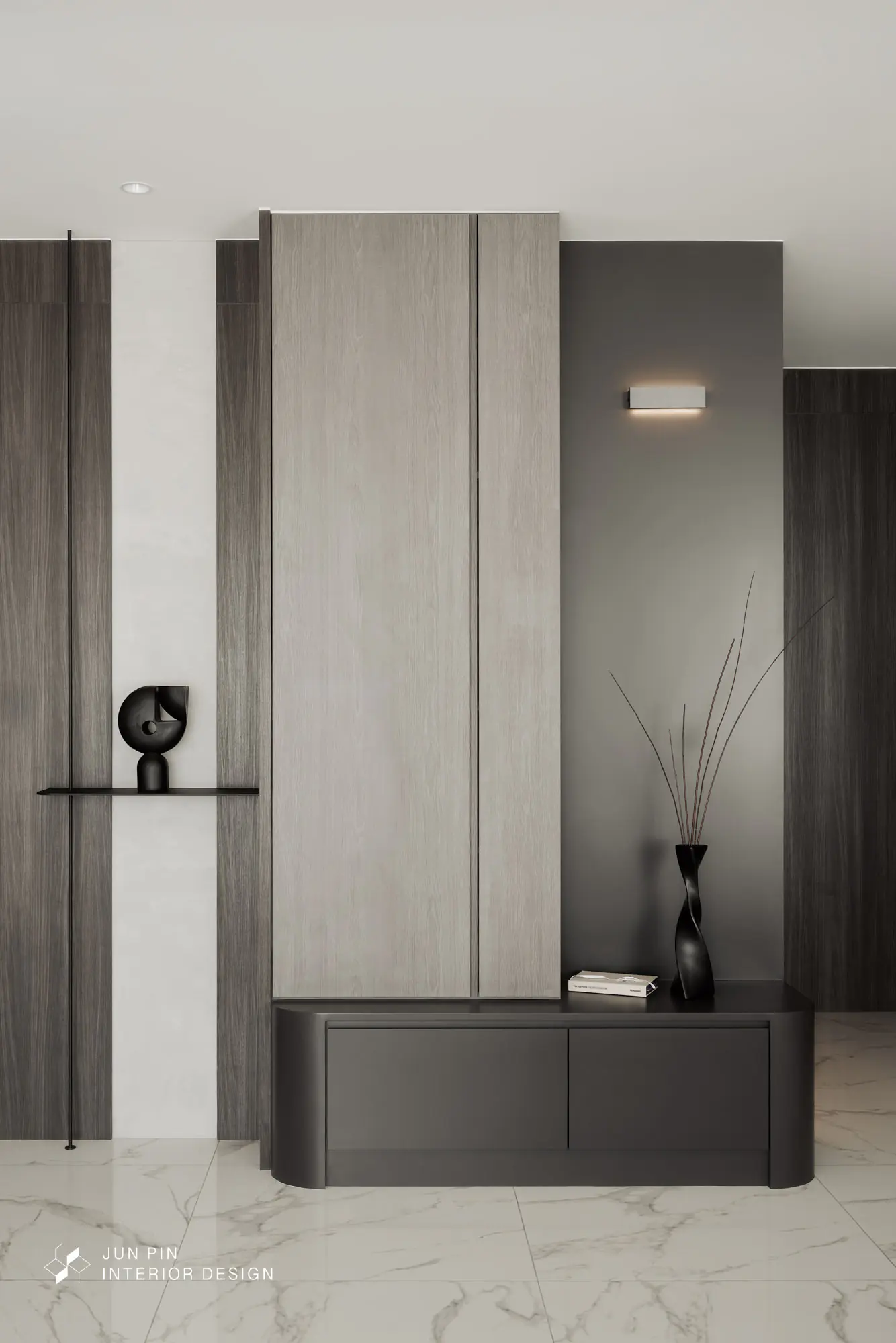 因屋主希望能保留原建商給的石紋地磚，因此設計師在玄關處也沒有特地設置落塵區，進門正對面是玄關櫃體，以黑色的櫃體作為玄關櫃，與白色的石紋地磚產生較明顯的對比，展現明顯的層次感。