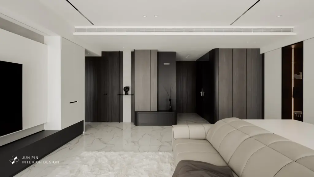 喜歡屋主現代風格的屋主，期望家在用色上也是以簡單的黑白灰為主，並希望家中有完善的收納功能，能將所有的雜物都收起來，以便日後打掃方便，但卻又不希望太多櫃體影響空間視覺，所以設計師就使用最基礎的黑白灰作為空間配色，並設置了許多隱藏式收納，讓空間看起來線條乾淨、簡約，卻有足夠的收納空間。