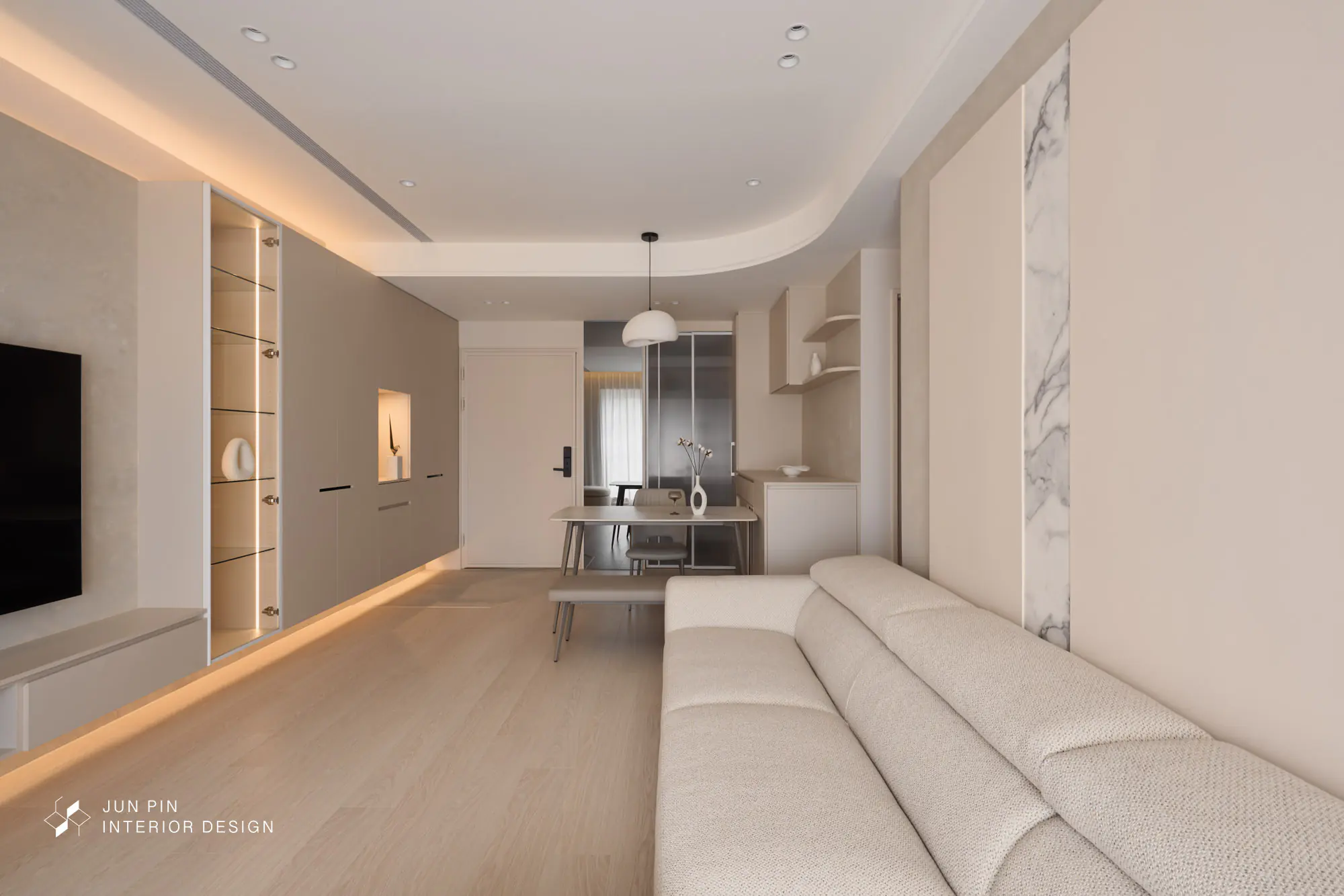 玄關用地板顏色區做出落塵區（穿鞋區）與室內區的區分。門口牆面放了一整面的落地灰鏡，放大視覺空間，同時兼具出門前的穿搭檢查機能。天花板的導角設計，將視覺延伸至落地窗。